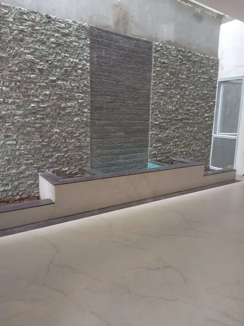 Spacious living hall with natural light at Lake Waters villa