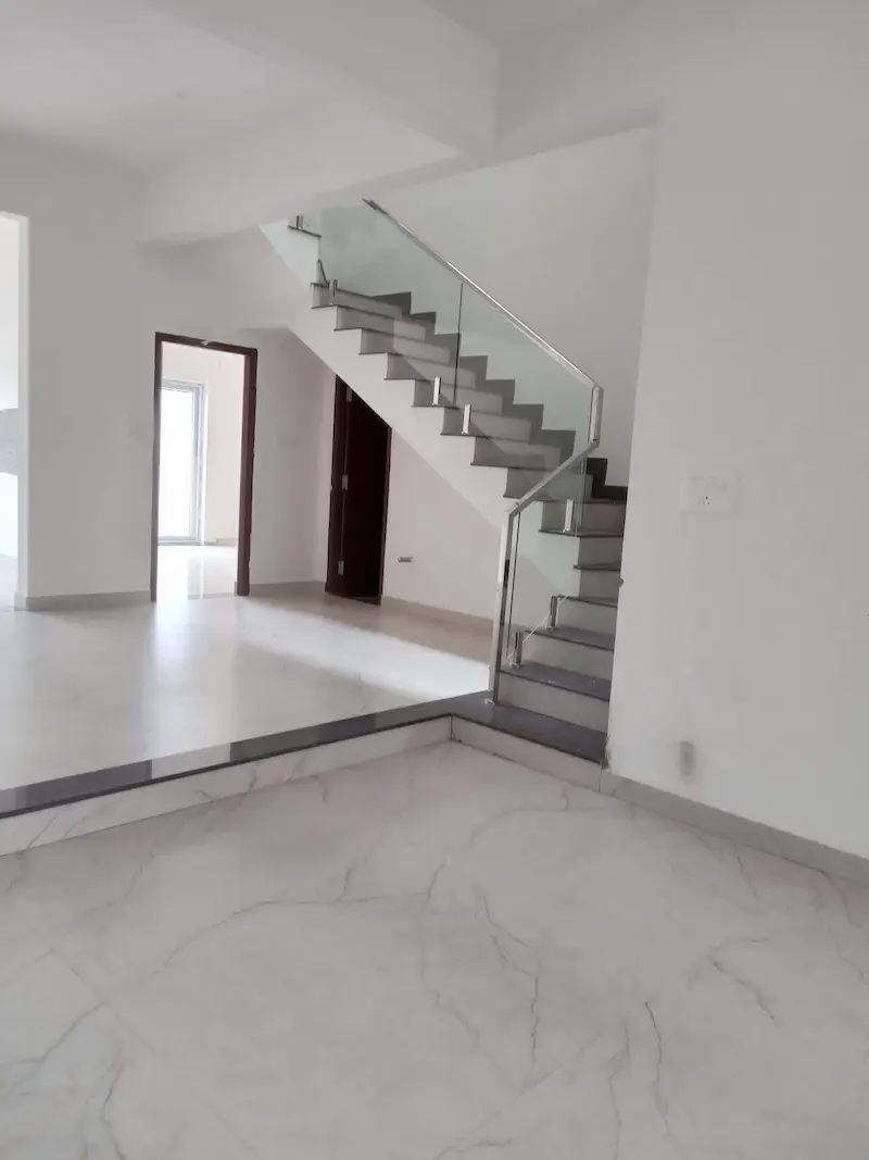 Modern staircase design inside Lake Waters villa